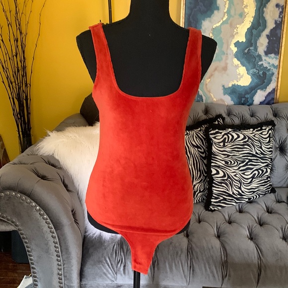 Tops - Beautiful burnt orange ribbed body suit new without tags